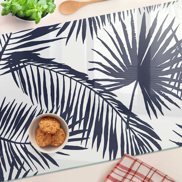 Snijplanken van glas Palmbladeren op een witte achtergrond