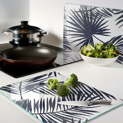 Snijplanken van glas Palmbladeren op een witte achtergrond