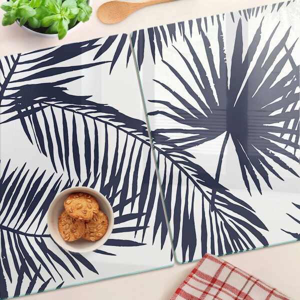 Snijplanken van glas Palmbladeren op een witte achtergrond