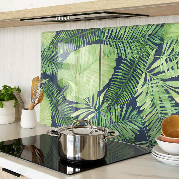 Snijplanken van glas Tropische bladeren op een donkere achtergrond