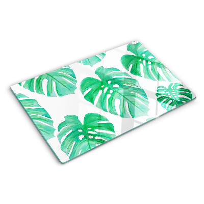 Snijplanken van glas Monstera-bladeren op een witte achtergrond