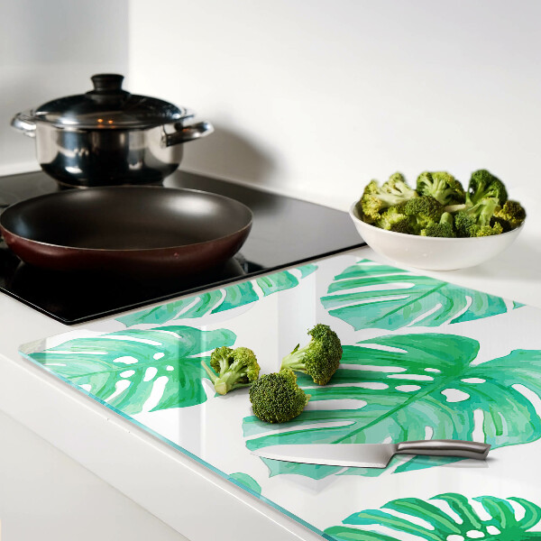 Snijplanken van glas Monstera-bladeren op een witte achtergrond