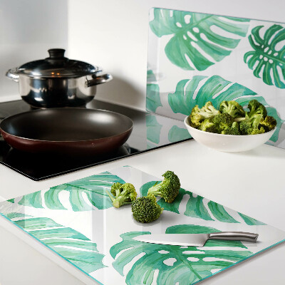 Snijplanken van glas Monstera-bladeren op een witte achtergrond