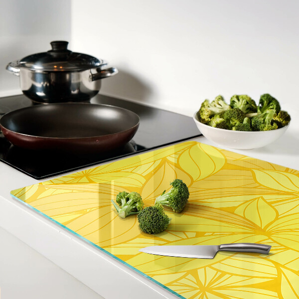 Snijplanken van glas Gele bladeren in een tropische stijl