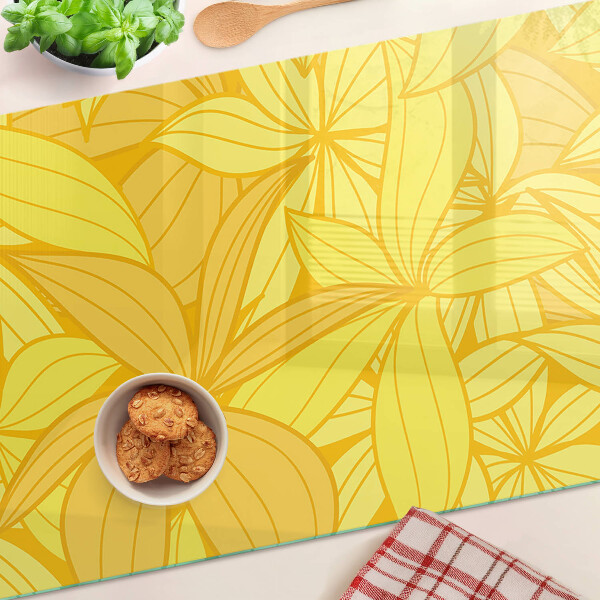 Snijplanken van glas Gele bladeren in een tropische stijl