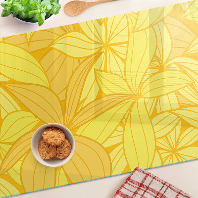 Snijplanken van glas Gele bladeren in een tropische stijl