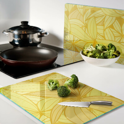 Snijplanken van glas Gele bladeren in een tropische stijl