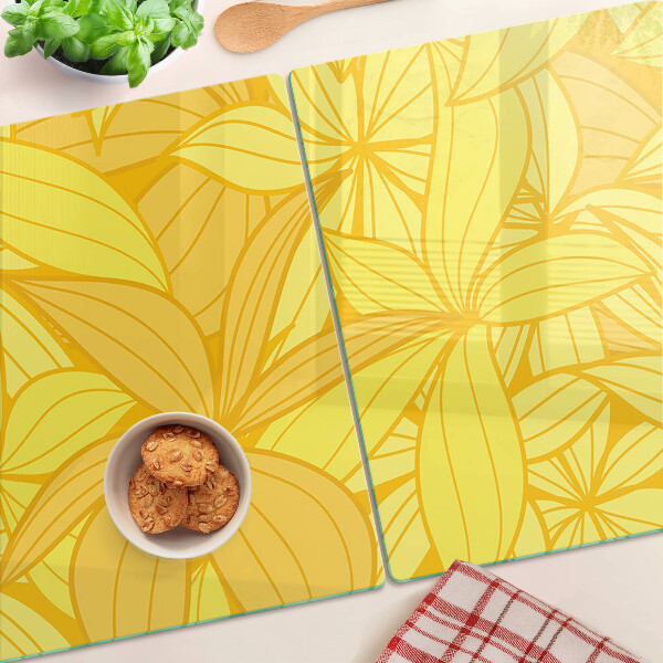 Snijplanken van glas Gele bladeren in een tropische stijl