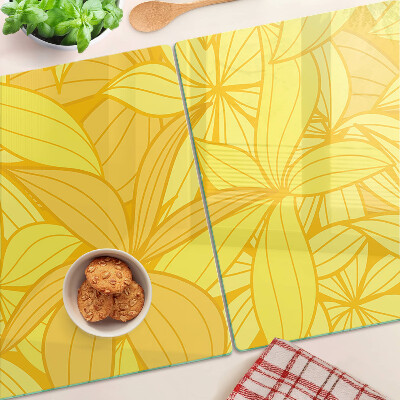 Snijplanken van glas Gele bladeren in een tropische stijl