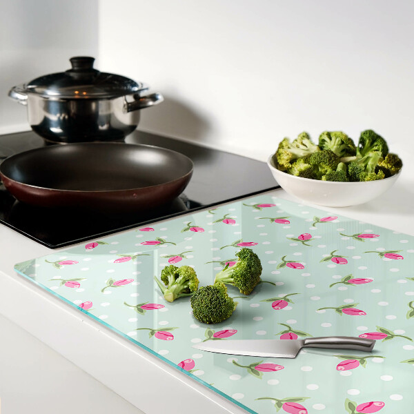 Snijplanken van glas Roze tulpen op een groene achtergrond