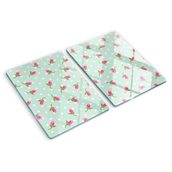 Snijplanken van glas Roze tulpen op een groene achtergrond