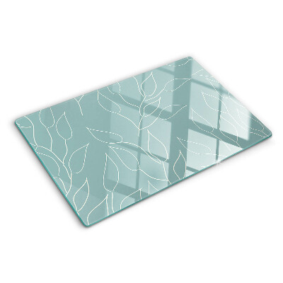 Glazen snijplanken Bladeren op de achtergrond