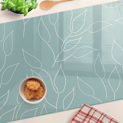 Glazen snijplanken Bladeren op de achtergrond