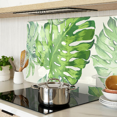 Snijplanken glas Monstera-bladeren op een lichte achtergrond