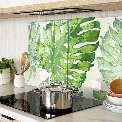 Snijplanken glas Monstera-bladeren op een lichte achtergrond