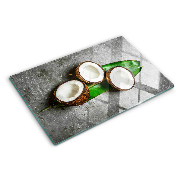 Glazen snijplanken Kokosnoot op een betonnen achtergrond