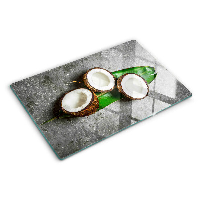 Glazen snijplanken Kokosnoot op een betonnen achtergrond