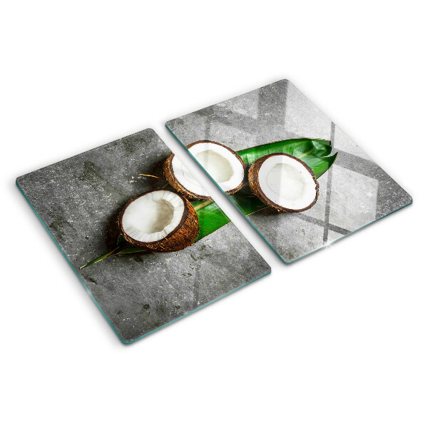 Glazen snijplanken Kokosnoot op een betonnen achtergrond