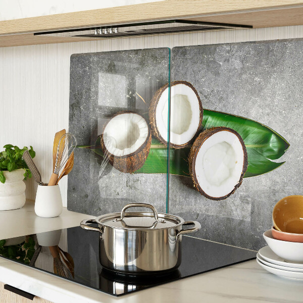 Glazen snijplanken Kokosnoot op een betonnen achtergrond