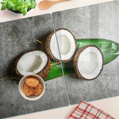 Glazen snijplanken Kokosnoot op een betonnen achtergrond