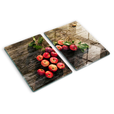 Snijplanken van glas Appels op een houten achtergrond