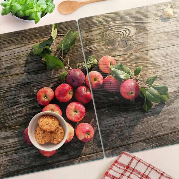Snijplanken van glas Appels op een houten achtergrond