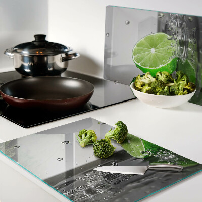 Snijplanken van glas Citroenen in water