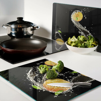 Snijplanken van glas Citrusvruchten in water