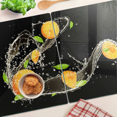 Snijplanken van glas Citrusvruchten in water