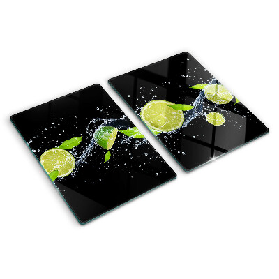 Snijplanken van glas Citroenen in water met muntblaadjes