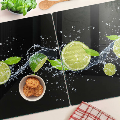 Snijplanken van glas Citroenen in water met muntblaadjes