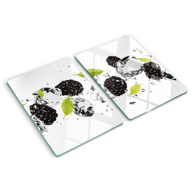 Snijplanken van glas Frambozen met blaadjes en waterdruppels