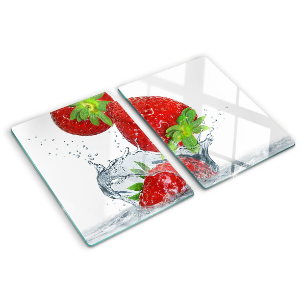 Snijplanken van glas Aardbeien in water