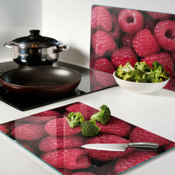 Glazen snijplanken Frambozen op de achtergrond