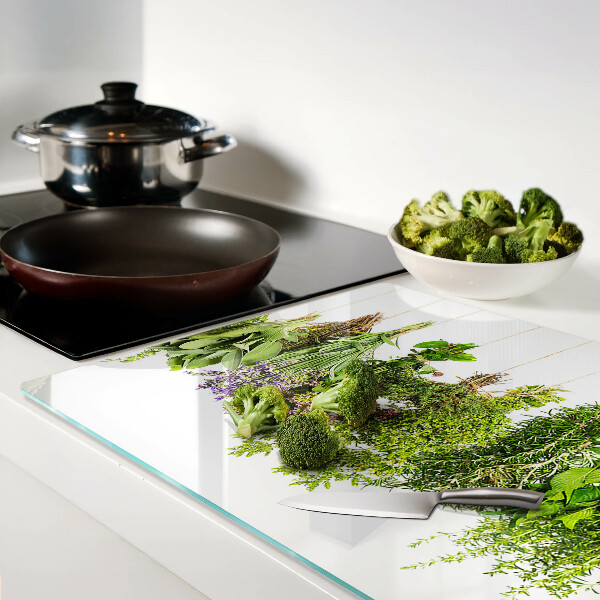 Snijplanken van glas Kruiden hangen aan een touwtje