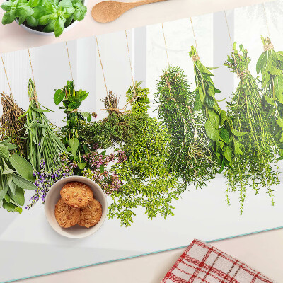 Snijplanken van glas Kruiden hangen aan een touwtje