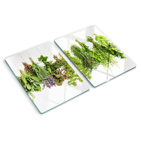 Snijplanken van glas Kruiden hangen aan een touwtje