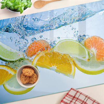 Snijplanken van glas Citrusvruchten in water