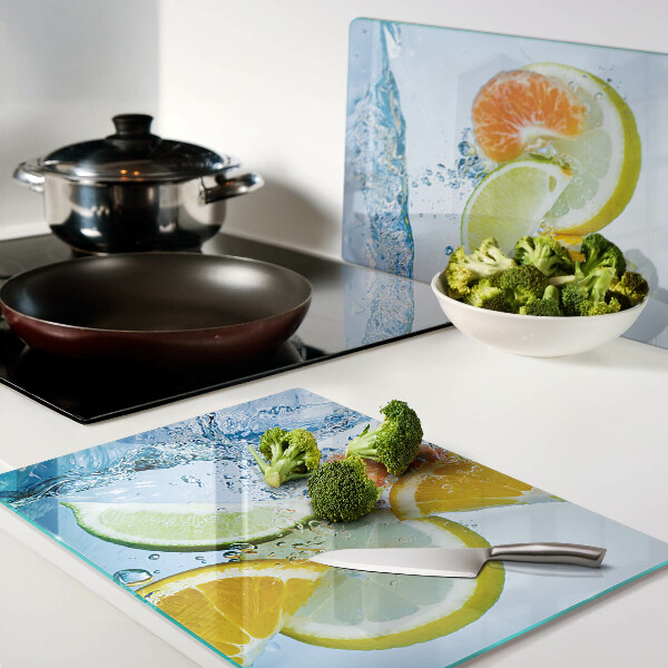 Snijplanken van glas Citrusvruchten in water