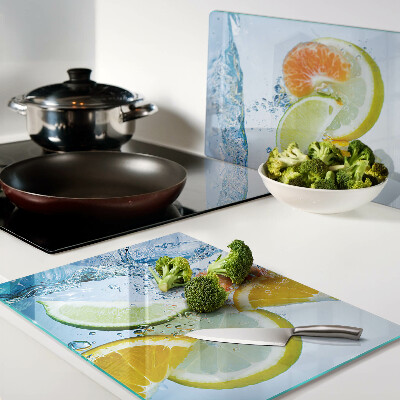 Snijplanken van glas Citrusvruchten in water