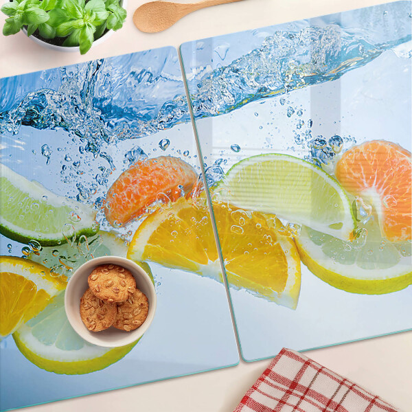 Snijplanken van glas Citrusvruchten in water