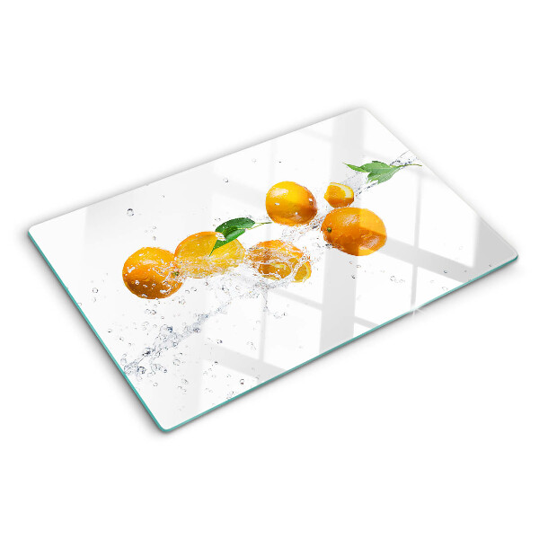 Snijplanken van glas Citrusvruchten met water