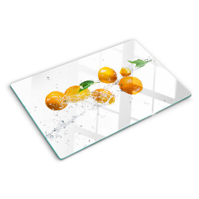 Snijplanken van glas Citrusvruchten met water