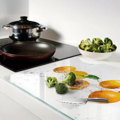 Snijplanken van glas Citrusvruchten met water