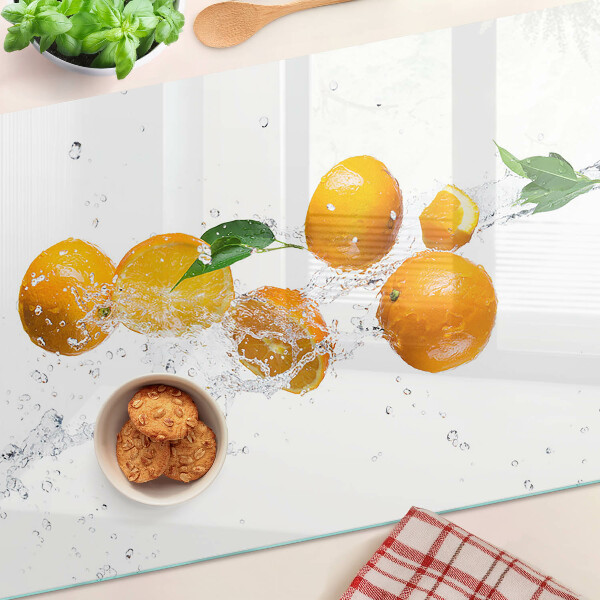 Snijplanken van glas Citrusvruchten met water