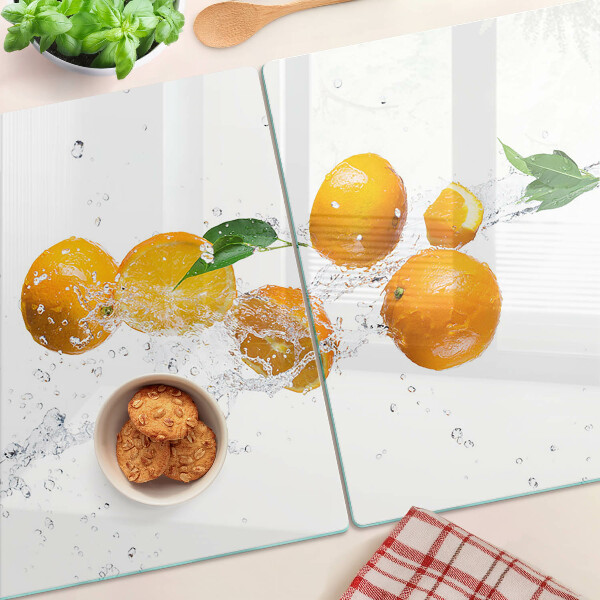 Snijplanken van glas Citrusvruchten met water