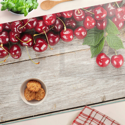 Snijplanken van glas Kersen op een houten achtergrond