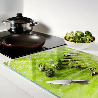 Snijplanken van glas Kiwi met waterdruppels