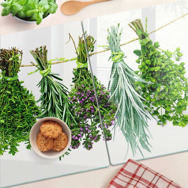 Glazen snijplanken Gedroogde kruiden aan een touwtje