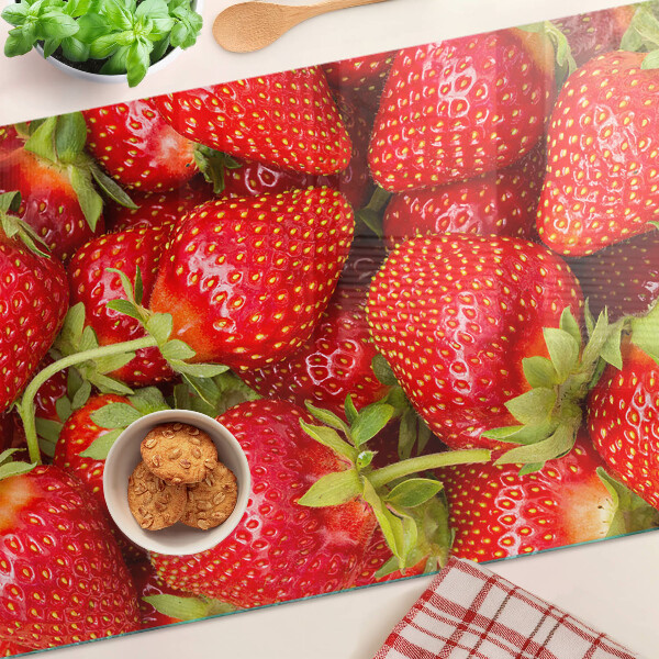 Glazen snijplanken Aardbeien op de achtergrond